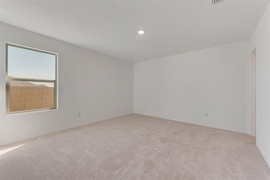 Unfurnished room featuring light colored carpet