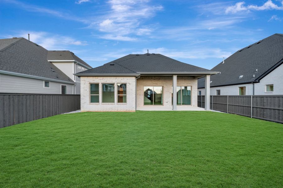 Exterior details and patio area of a home in Goodland – Classic Series, Grand Prairie (Image 3).