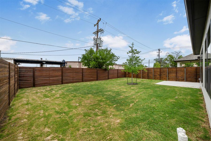 View of yard featuring a patio area. View of yard featuring a patio area.