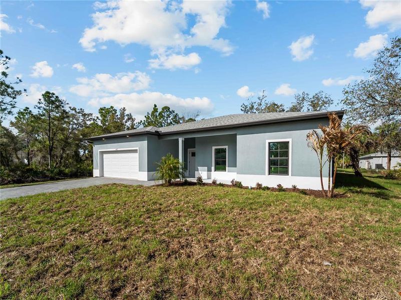 Exterior details and patio area of a home in , North Port (Image 39).