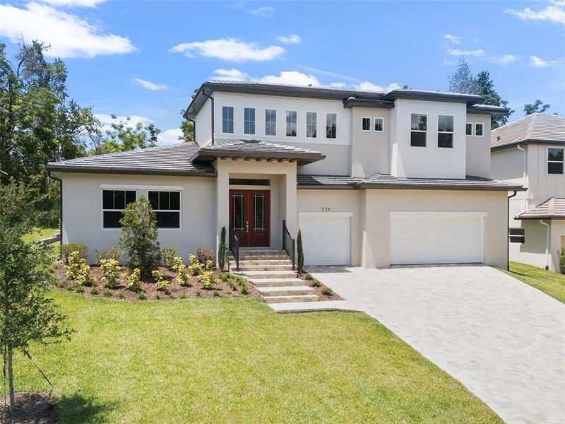 Front exterior of a new home in , Apopka, FL, highlighting curb appeal (Image 23).