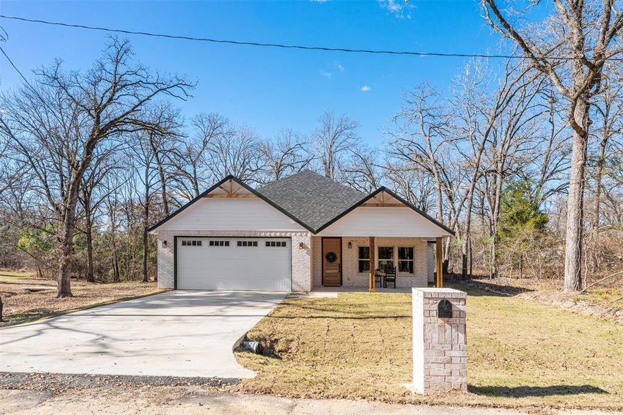 Front exterior of a new home in , Trinidad, TX, highlighting curb appeal (Image 22).