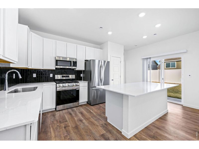 Furnished interior view inside a new home in Union Colony West, Greeley (Image 7).