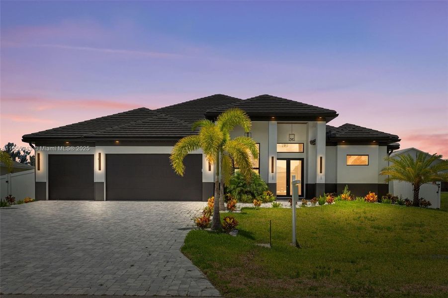 STRIKING EXTERIOR PALETTE of CHARCOAL GRAY, BLACK, and CRISP WHITE, this NEW CONSTRUCTION HOME blends BOLD CURB APPEAL with ELEGANT DESIGN, inviting you to own a piece of paradise!