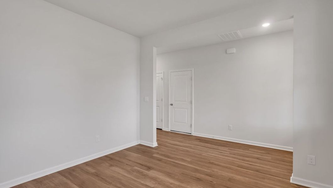 Representative unfurnished interior of a home built from the GLYNN by D.R. Horton in Grayson Park, Leland (Image 14).