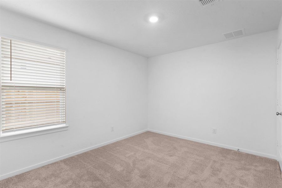 Unfurnished room with light carpet and baseboards