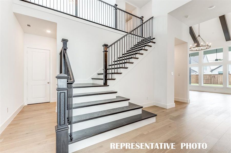 Beautiful and stylish metal railing makes a grand statement in this gorgeous home!  REPRESENTATIVE PHOTO