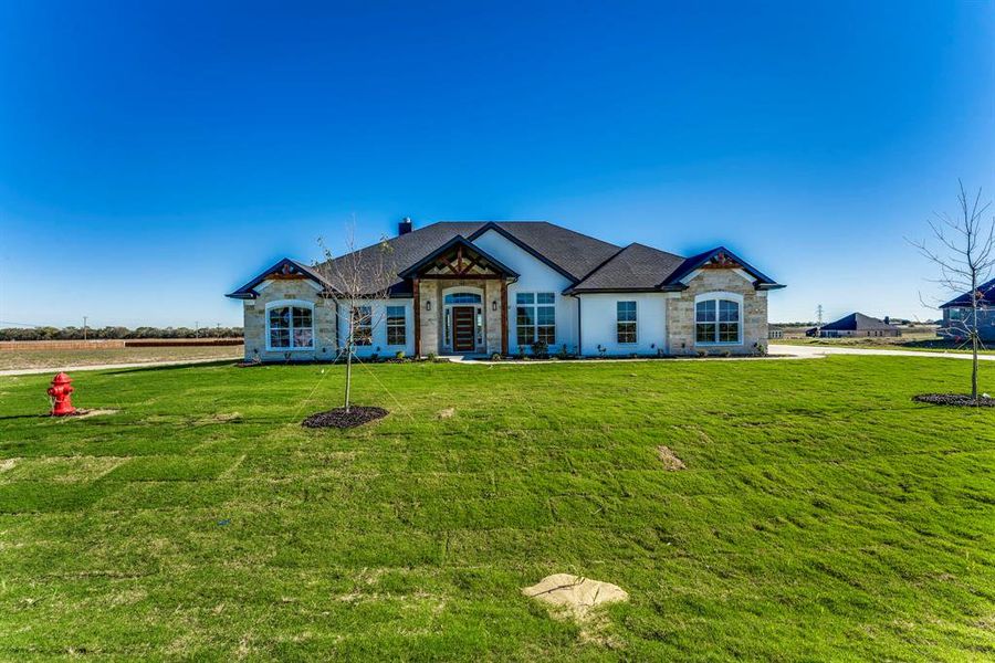 View of front of house with a front lawn