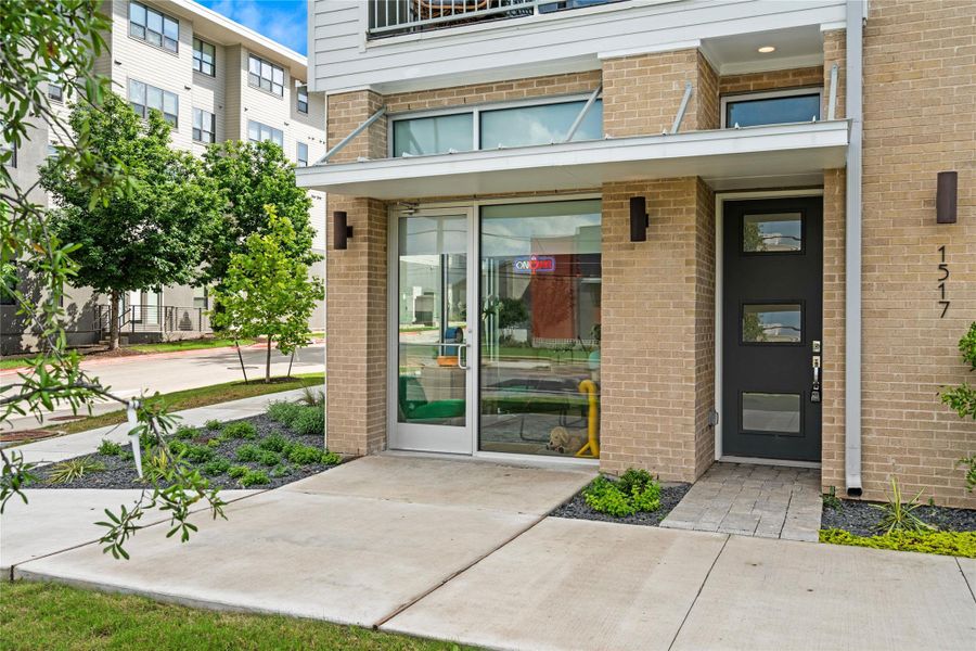 Modern brick and siding facade with a contemporary black entry door