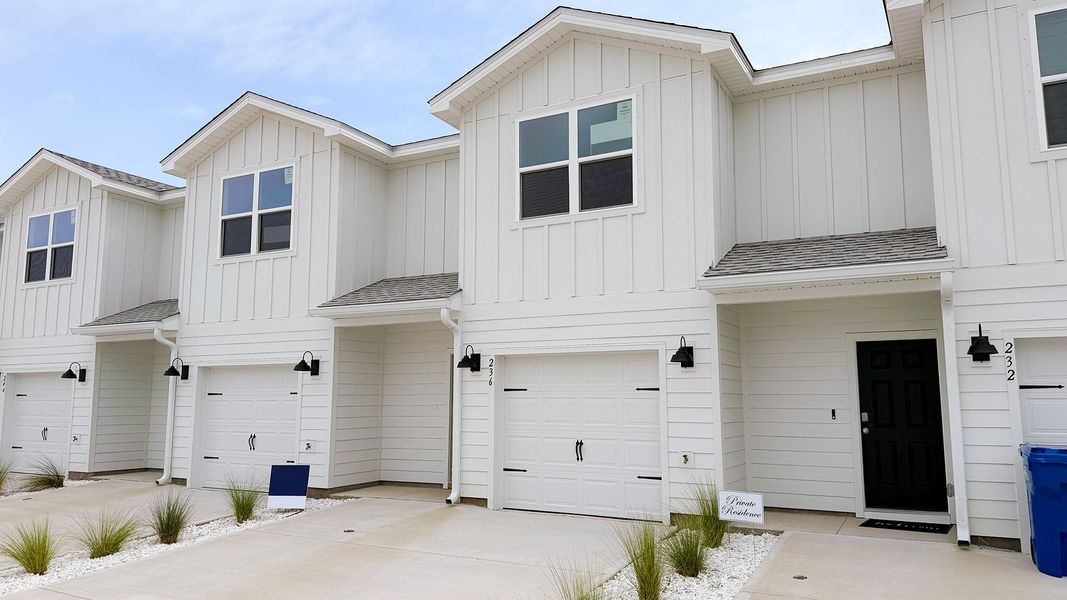 Front exterior of a new home in Salt Creek Townhomes at Mexico Beach, Mexico Beach, FL, highlighting curb appeal (Image 19).