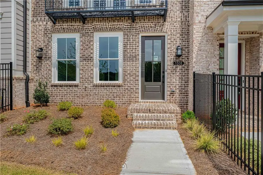 Exterior details and patio area of a home in Waterhaven, Cumming (Image 32).
