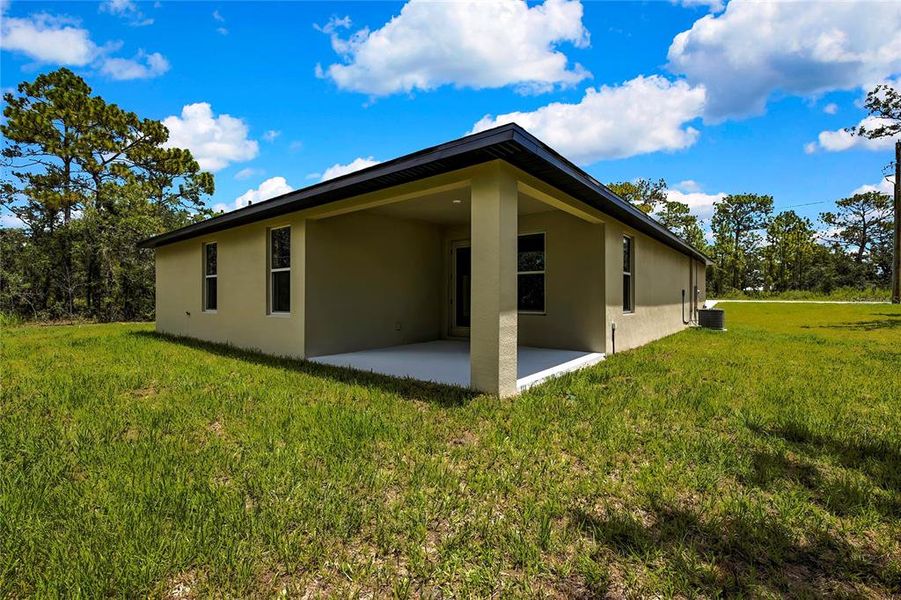 Front exterior of a new home in , Brooksville, FL, highlighting curb appeal (Image 27).