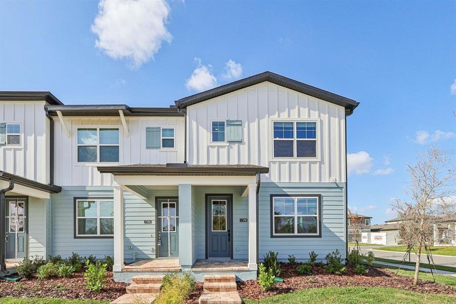 Front exterior of a new home in , Winter Garden, FL, highlighting curb appeal (Image 1). Front exterior of a new home in , Winter Garden, FL, highlighting curb appeal (Image 1).