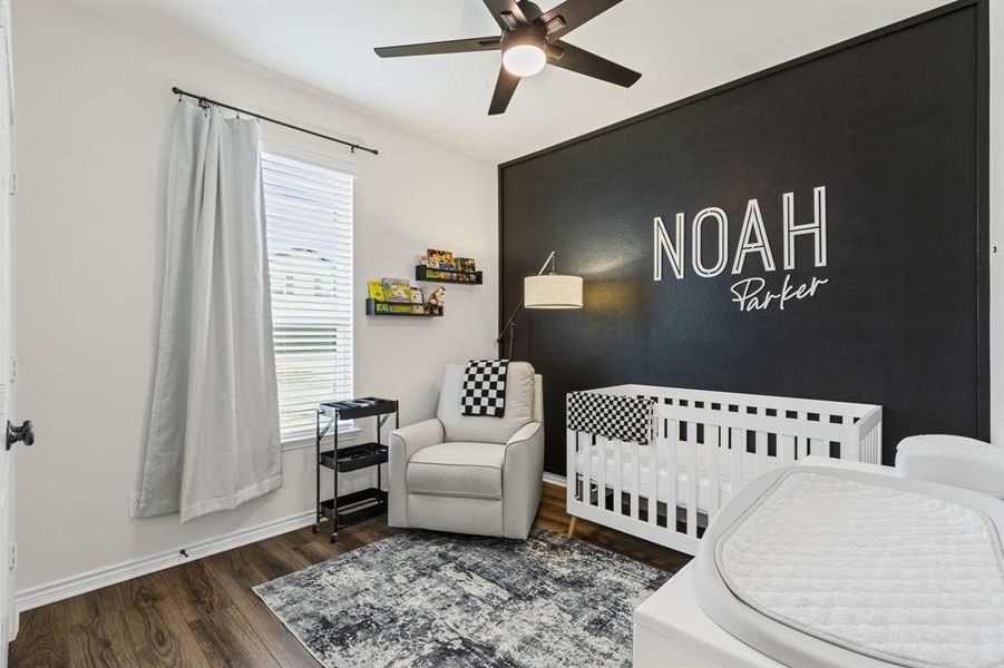 Cute secondary bedroom with LVP flooring & upgraded ceiling fan!