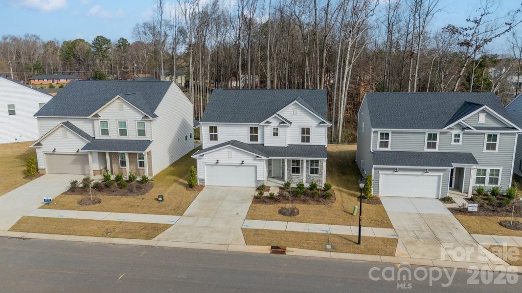 Front exterior of a new home in Stewarts Landing, Charlotte, NC, highlighting curb appeal (Image 20).