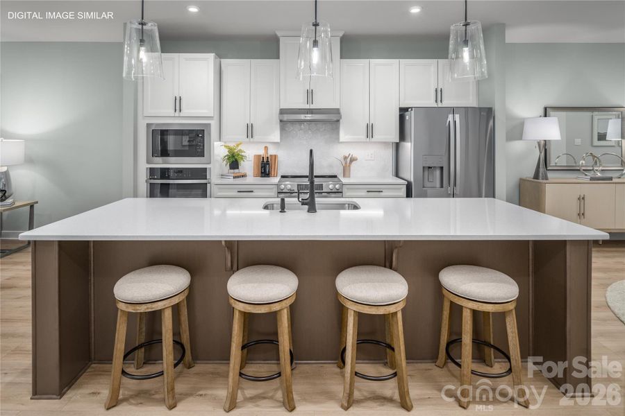 Oversized island with plenty of seating, perfect for gathering and everyday living. Oversized island with plenty of seating, perfect for gathering and everyday living.