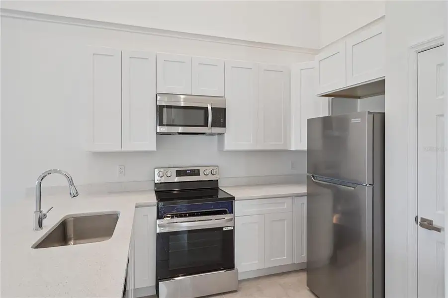 Furnished interior view inside a new home in , Kissimmee (Image 6).