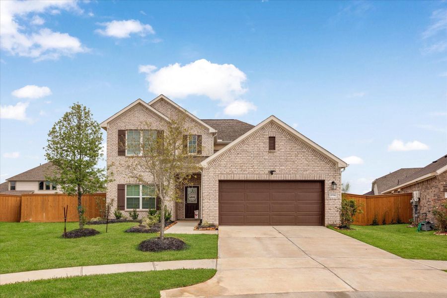 Front exterior of a new home in Marvida, Cypress, TX, highlighting curb appeal (Image 28).