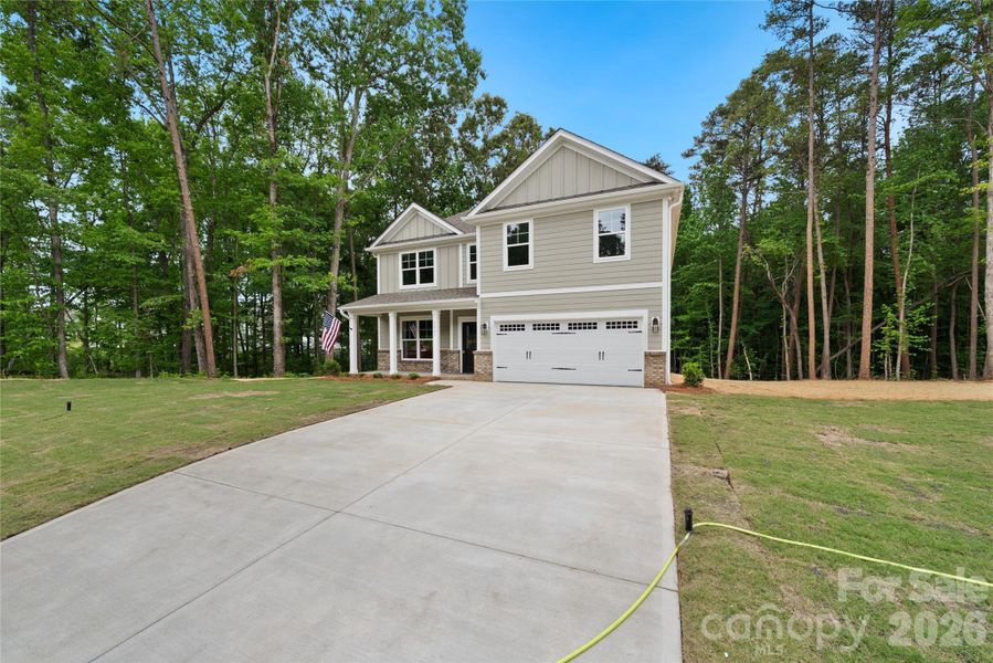Front exterior of a new home in , Stanfield, NC, highlighting curb appeal (Image 16).