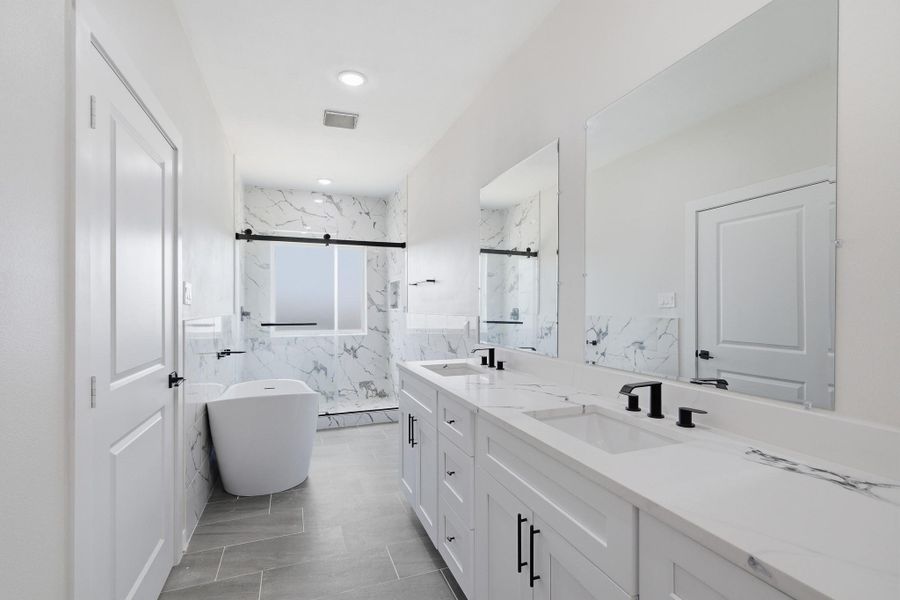 Ensuite bathroom with dual sinks, soaking tub and oversized shower Ensuite bathroom with dual sinks, soaking tub and oversized shower