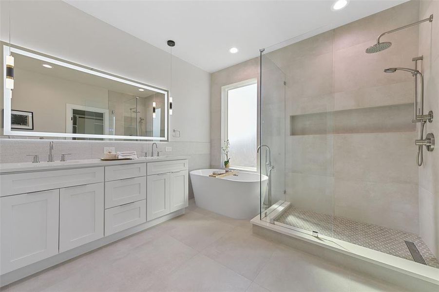 Bathroom with separate shower and tub, vanity, and tile patterned flooring