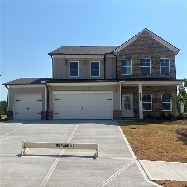 Front exterior of a new home in Rosewood Lake Estates, Hoschton, GA, highlighting curb appeal (Image 2). Front exterior of a new home in Rosewood Lake Estates, Hoschton, GA, highlighting curb appeal (Image 2).