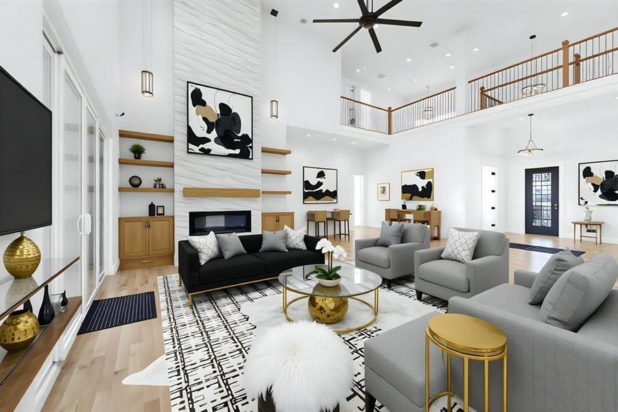 Virtually Staged Living room with light wood finished floors, a ceiling fan, a large fireplace, a high ceiling, and recessed lighting Virtually Staged Living room with light wood finished floors, a ceiling fan, a large fireplace, a high ceiling, and recessed lighting