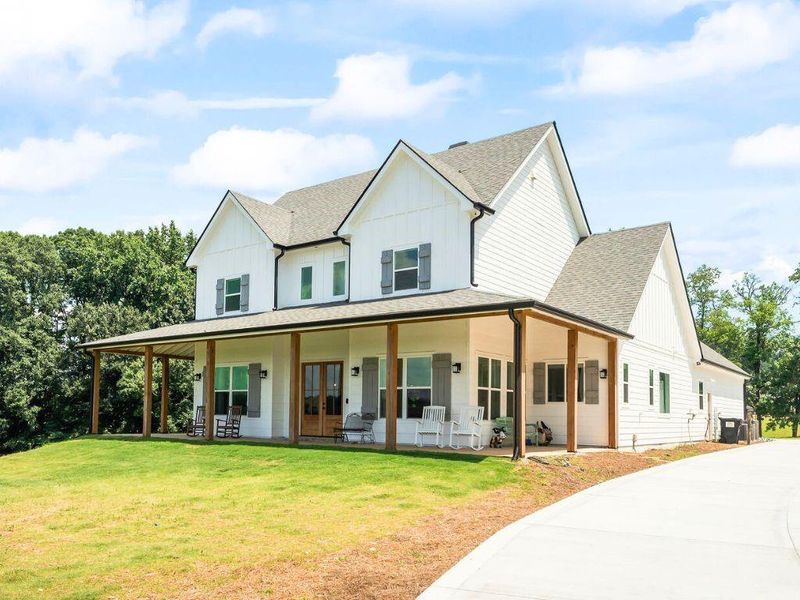 Front exterior of a new home in , Cumming, GA, highlighting curb appeal (Image 23).
