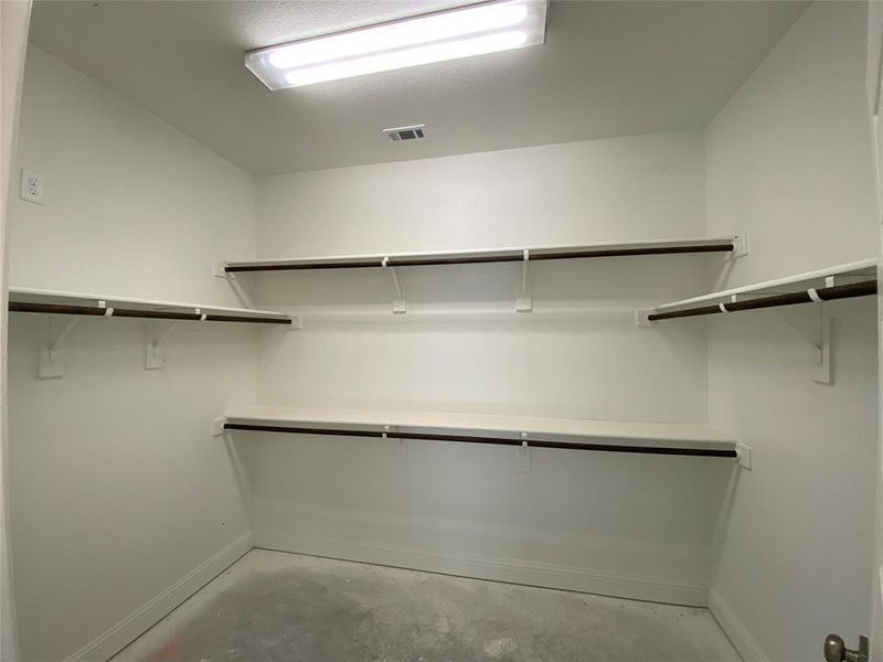 Master large walk-in closet with lots of storage