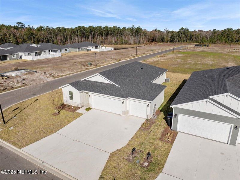 Front exterior of a new home in Azalea Creek, Jacksonville, FL, highlighting curb appeal (Image 19).