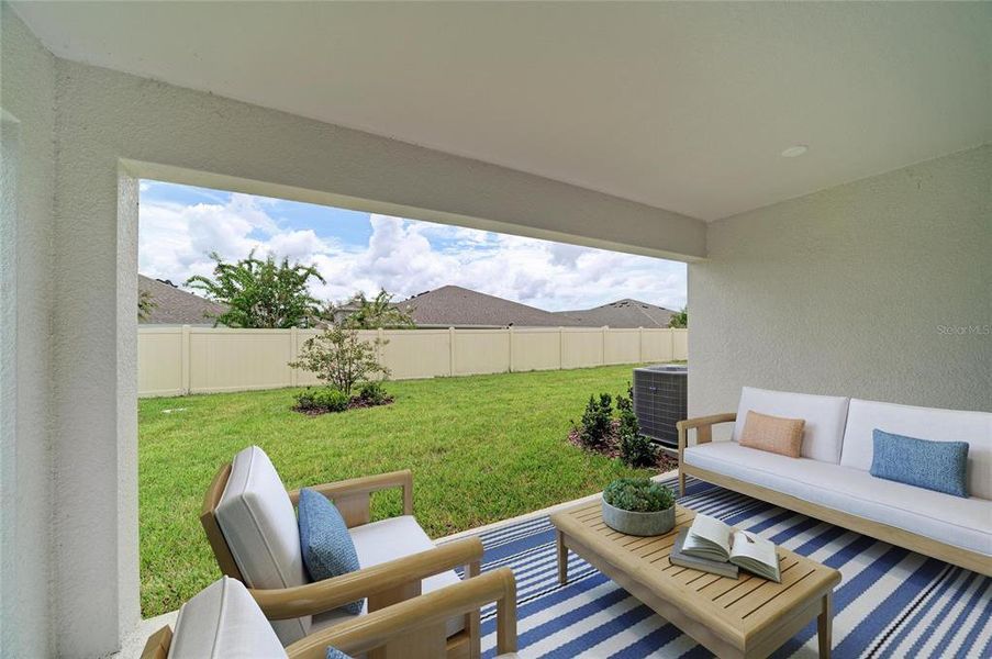 Exterior details and patio area of a home in Crosswind Point, Parrish (Image 15).