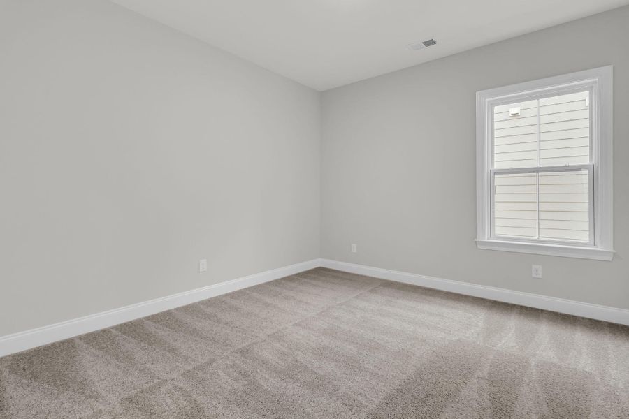 Spacious, unfurnished interior of a new home in Tidewater at Lakes of Cane Bay, Summerville (Image 40).
