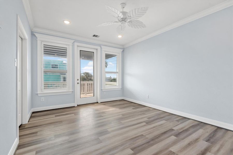 Primary bedroom with direct access to front patio.