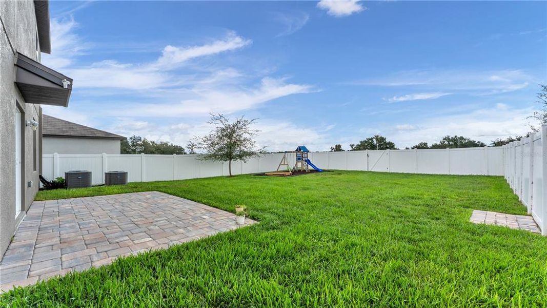 Exterior details and patio area of a home in Wind Meadows South, Bartow (Image 3).