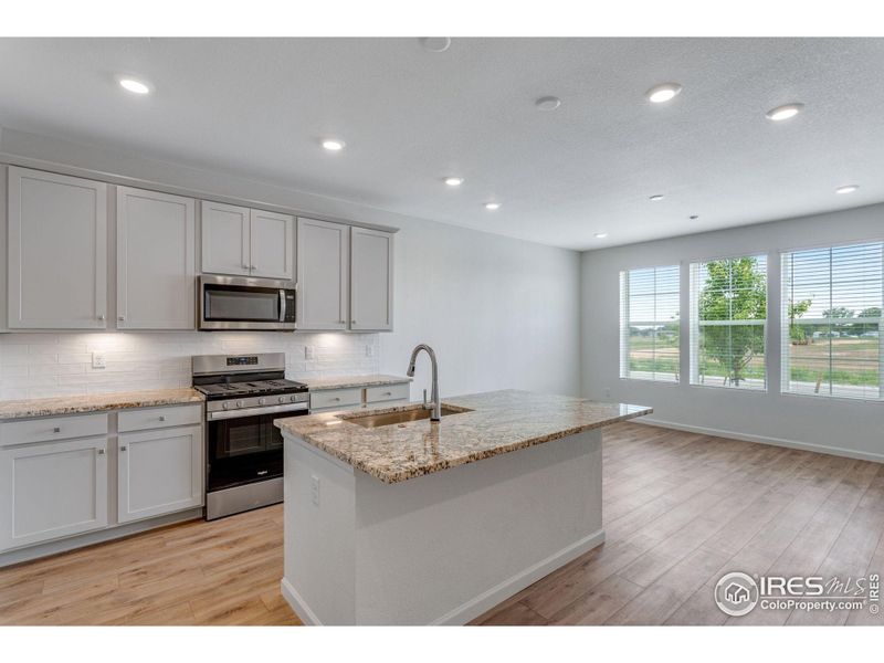 Furnished interior view inside a new home in Westside Crossing Townhomes, Berthoud (Image 10).