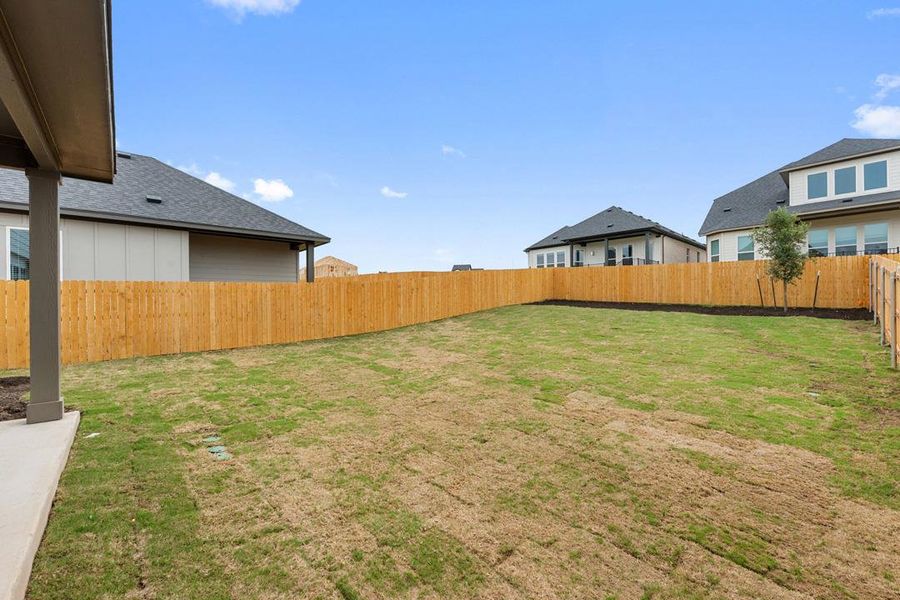 Exterior details and patio area of a home in Heritage, Dripping Springs (Image 24).