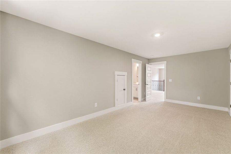 A spacious, naturally illuminated room featuring p