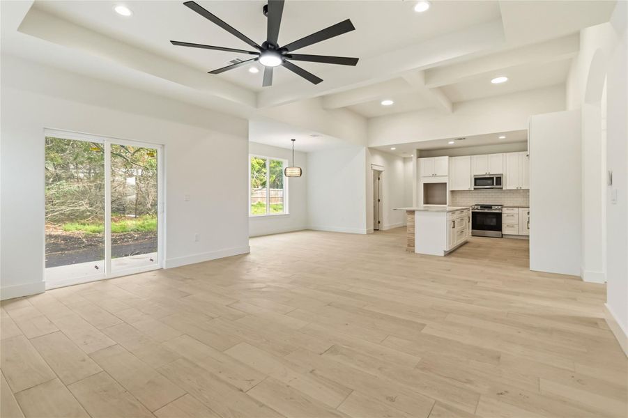Living open to dining and kitchen areas
