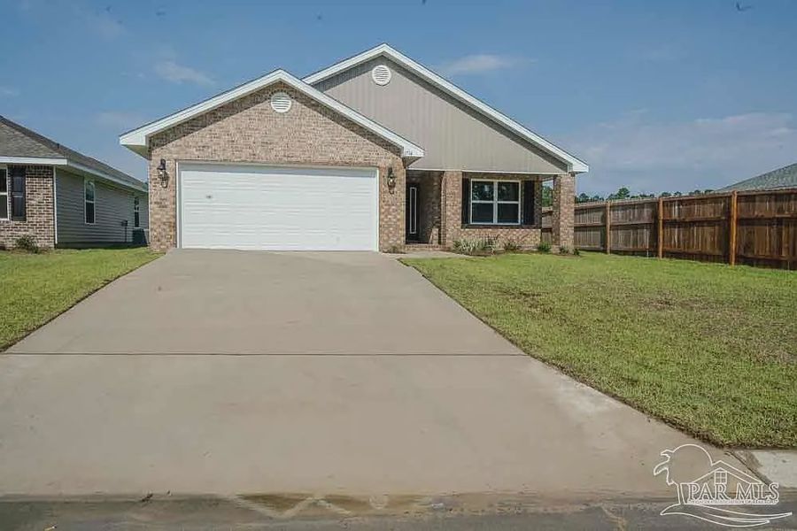 Front exterior of a new home in Pine Top, Cantonment, FL, highlighting curb appeal (Image 1).