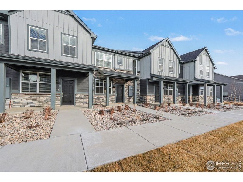 Front exterior of a new home in Poudre Heights: The Meadow Collection, Windsor, CO, highlighting curb appeal (Image 26).