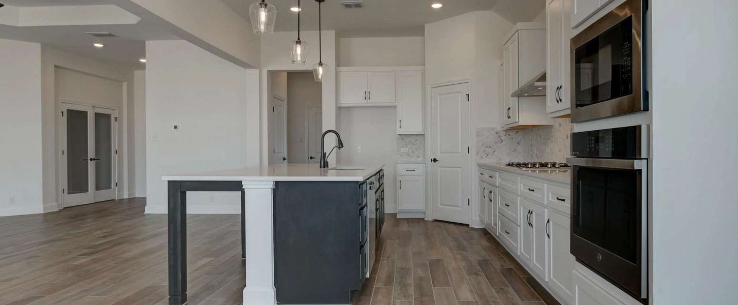 Image 18 representing the Ellington by Ashton Woods in Megan's Landing 70's, Castroville, TX.