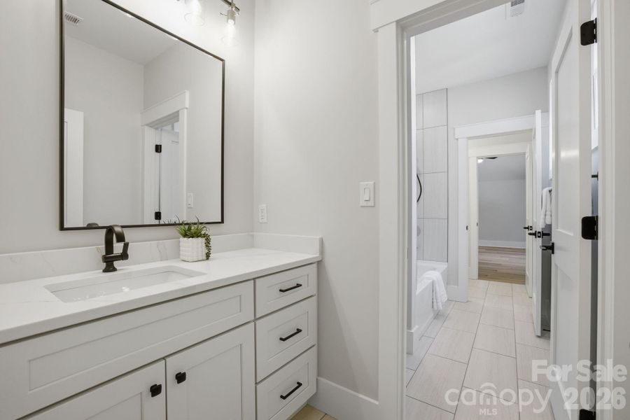Guest Suite Shared bath with private vanity area.