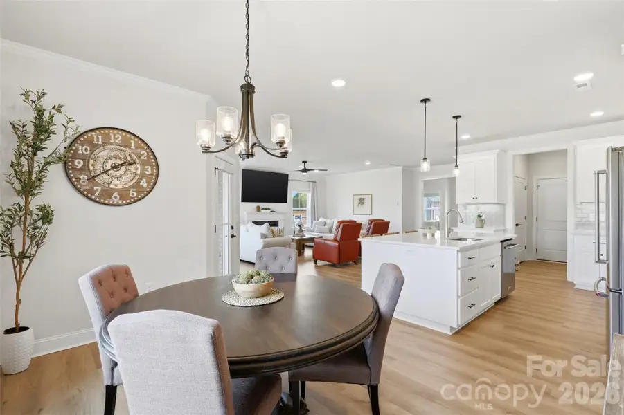 Elegant dining space with a modern fixture and effortless flow into the main living areas.