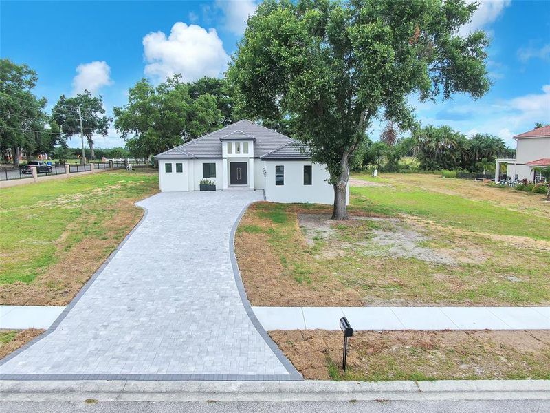 Front exterior of a new home in , Thonotosassa, FL, highlighting curb appeal (Image 25).
