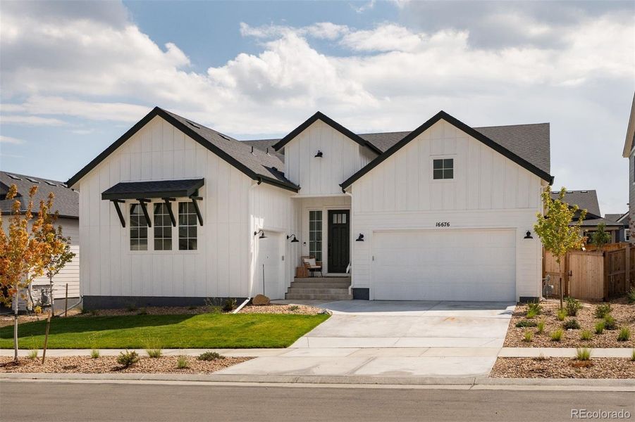 Front exterior of a new home in Trailstone Destination Collection, Arvada, CO, highlighting curb appeal (Image 20).
