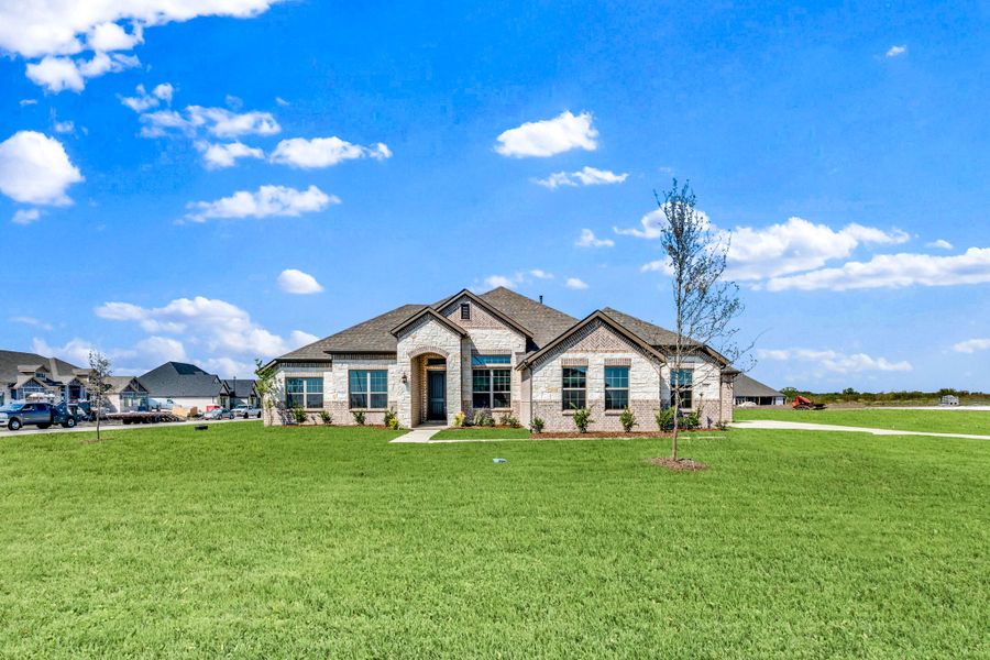 Front exterior of a new home in Berkshire Estates, Mesquite, TX, highlighting curb appeal (Image 17).