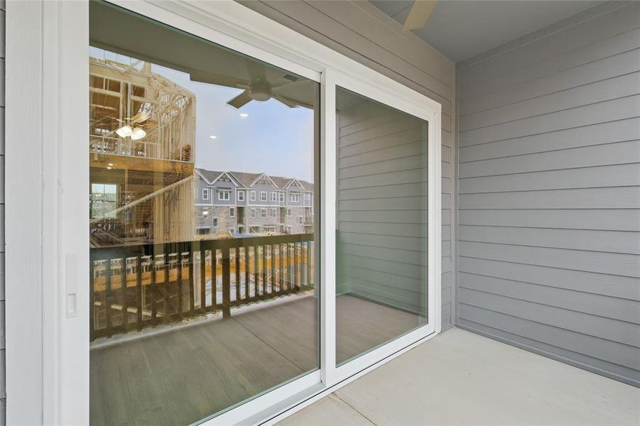 Balcony featuring ceiling fan