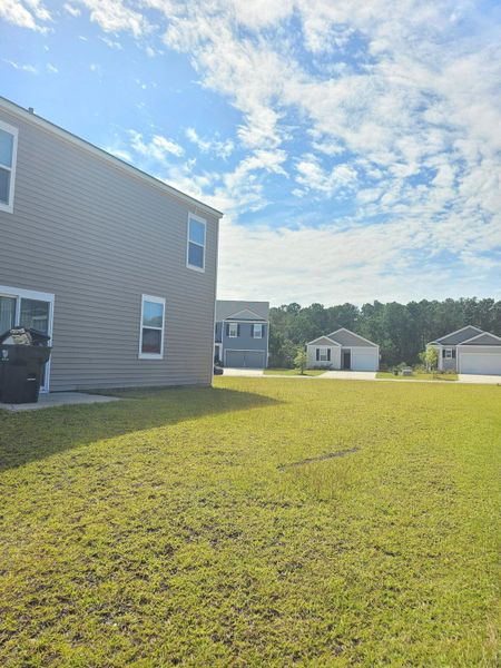 Front exterior of a new home in , Ladson, SC, highlighting curb appeal (Image 26).
