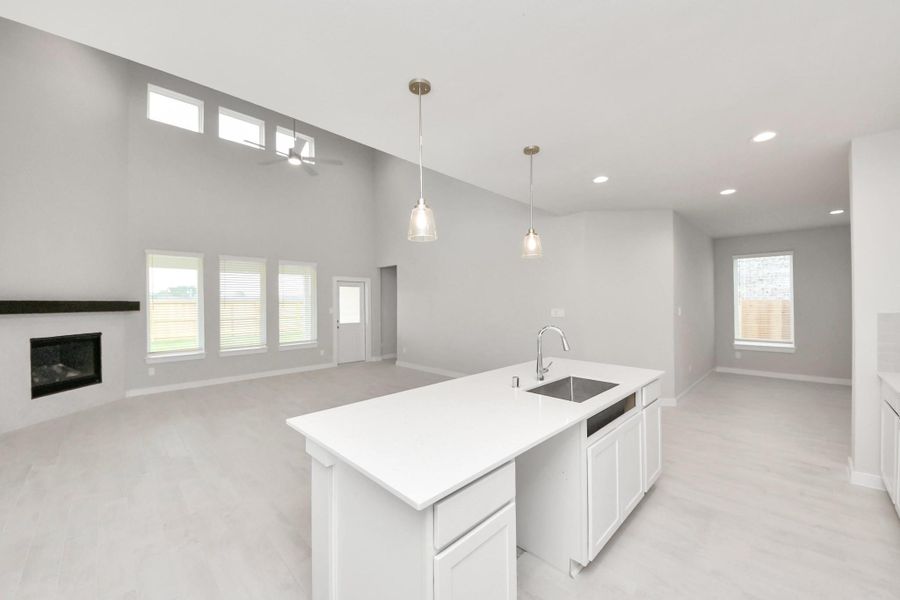 All of this overlooks your expansive family room, creating a perfect space for culinary delights and family gatherings. Sample photo of completed home with similar floor plan. Actual colors and selections may vary. All of this overlooks your expansive family room, creating a perfect space for culinary delights and family gatherings. Sample photo of completed home with similar floor plan. Actual colors and selections may vary.