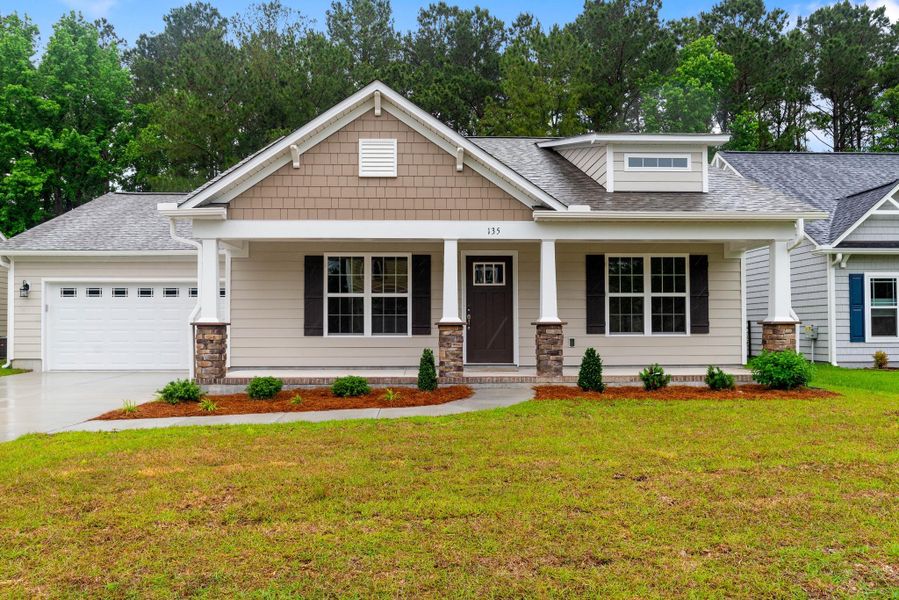 Representative exterior photo of a completed home built from the Kids 2 Car by JC Jackson Homes,LLC in Heritage Pointe, Newport, NC (Image 16).